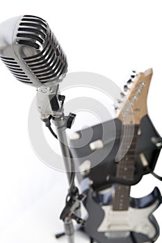 Vintage microphone, electric guitar and amp