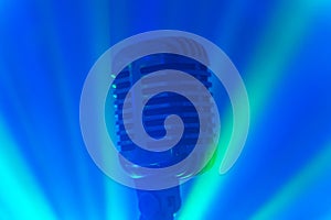 Vintage microphone with stage disco lights.