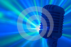 Vintage microphone with stage disco lights.