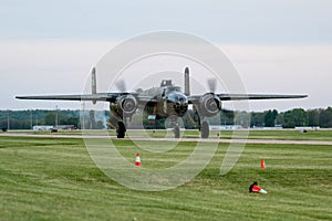 Vintage military aircraft displayed in an airbase photo