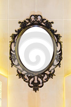 Vintage mirror with metal classic frame on the wall