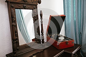 Vintage mirror and old gramophone