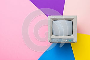 Vintage monitor with a kinescope on a multicolored background. Vintage electronics. photo