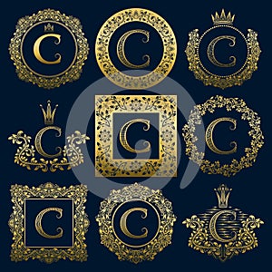 Vintage monograms set of C letter. Golden heraldic logos in wreaths, round and square frames photo