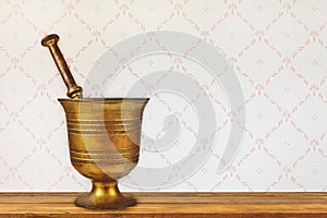 Vintage mortar on an old wooden table