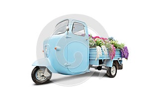 Vintage motorbike with flowers in trunk