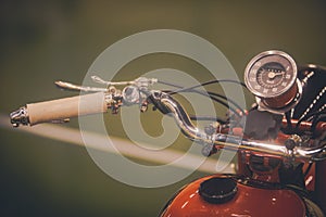 Vintage motorcycle handlebars and speedometer