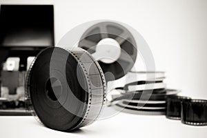 Vintage movie editing desktop in black and white with 35mm reel