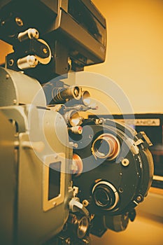 Vintage movie projector in a cinema hall