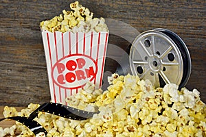 Vintage movie reel with popcorn photo