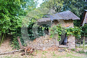 Vintage mowing machine and old bread oven