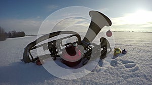 Vintage musical instruments on snow with Christmas decorations, time lapse 4 K