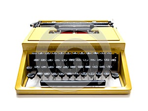 Vintage mustard yellow typewriter on a white background