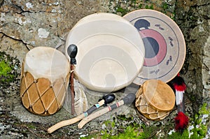 Four Native American Drums with Drumsticks.