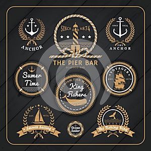 Vintage nautical labels set on dark wood background