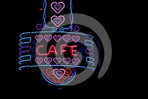 Vintage Neon Cafe Sign on Small Town Restaurant at Night