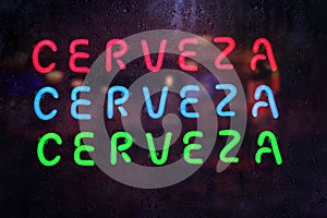 Vintage Neon Cerveza Sign in Rainy Window - Cerveza is Spanish for Beer photo