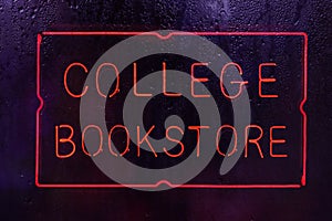 Vintage Neon College Bookstore Sign in Rainy Window