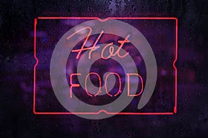 Vintage Neon Hot Food Sign in Rainy Window