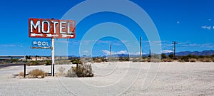 A vintage neon motel sign in the desert