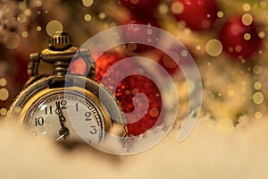 Vintage New year clock and cones covered with snow