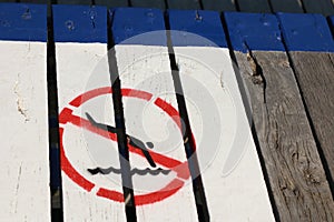 Vintage no diving picture painted signage at a seaside beach salt water pool on a hot summer day, Geelong, Victoria, Australia