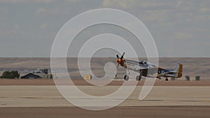 Vintage North American Aircrafts P-51 Mustang and T-6 Texan on a Runway