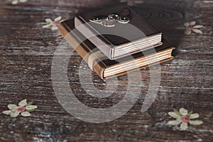 Vintage notebook with leather cover on the wooden table