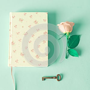 Vintage notebook and rose