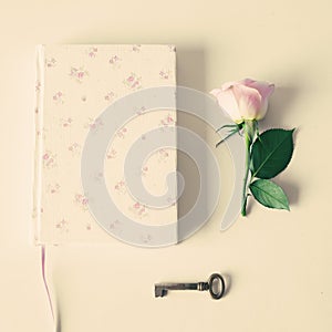 Vintage notebook and rose