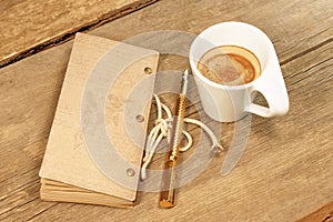 Vintage Notepad, Golden Fountain Pen and Cup of Espresso on Wood