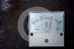 Vintage old analog volt meter scale of measurement device