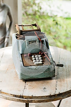 Vintage old antique telephone on wood table.