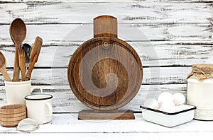 Vintage old baking utensils on a white wooden background
