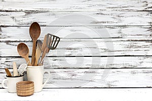 Vintage old baking utensils on a white wooden background