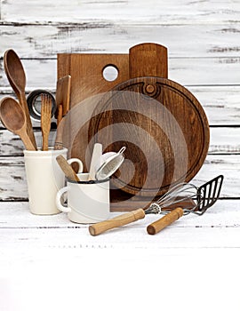 Vintage old baking utensils on a white wooden background