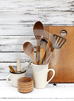 Vintage old baking utensils on a white wooden background