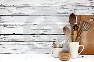 Vintage old baking utensils on a white wooden background