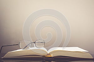 Vintage old book and glasses