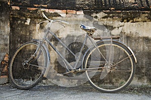 Vintage old classic bicycle against stop at the wall