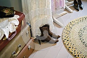 Vintage old dressing room with suitcases dresses and shoes