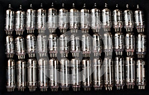 Vintage, old electronic radio vacuum tubes background on a black backdrop