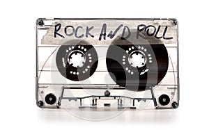 vintage old film music cassette isolated on white background with the inscription rock and roll, background music, music