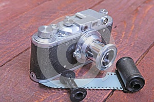 Vintage old film photo-camera in leather case