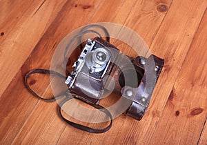 Vintage old film photo-camera in leather case