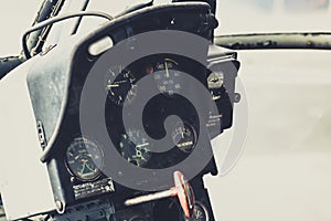 Old helicopter cockpit copter dashboard with displays guages