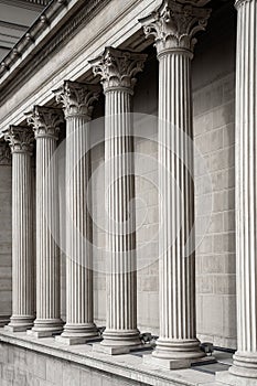 Vintage Old Justice Courthouse Column. Neoclassical colonnade with corinthian columns as part of a public building