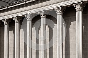 Vintage Old Justice Courthouse Column. Neoclassical colonnade with corinthian columns as part of a public building