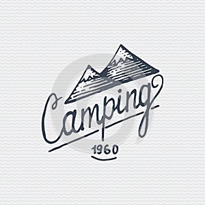 Vintage old logo or badge, label engraved and old hand drawn style with lettering camping and mountains