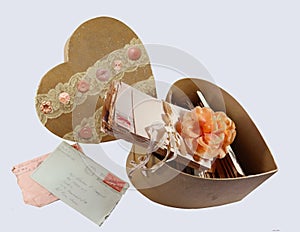 Vintage old love letters in a valentine box hand decorated with buttons and lace